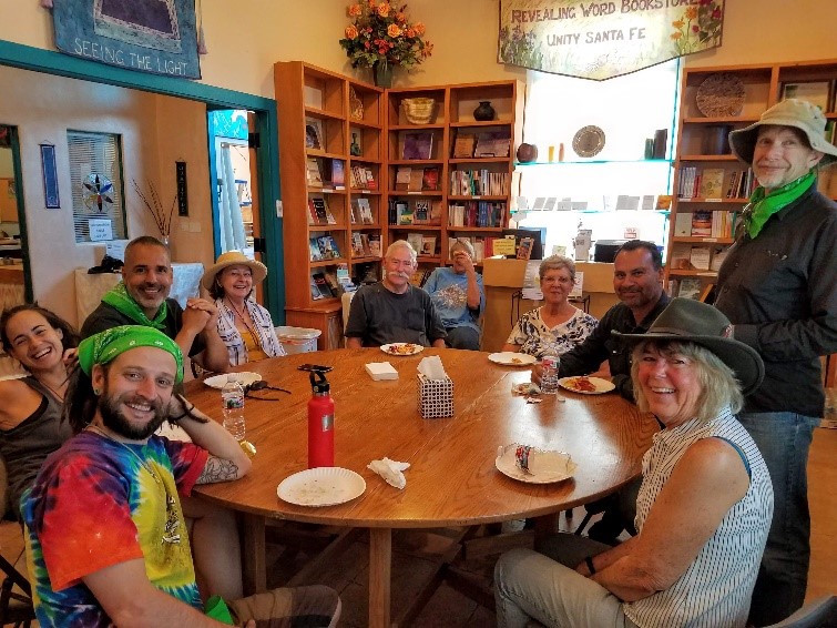 A group of people sitting around a tableDescription automatically generated